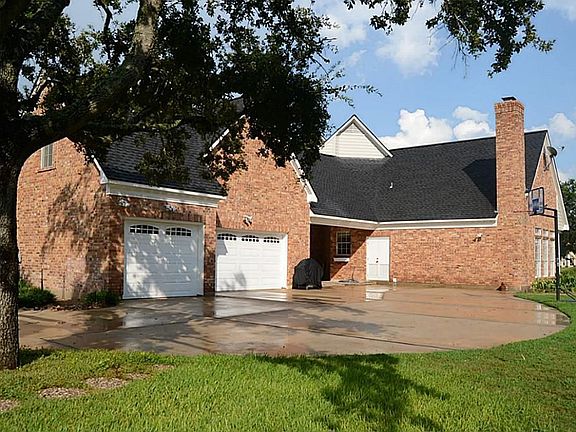 Long driveways add to the charm and this extended one leads to the circular drive that accesses the Motor Court, rear-entry and over-sized 3-car garages.