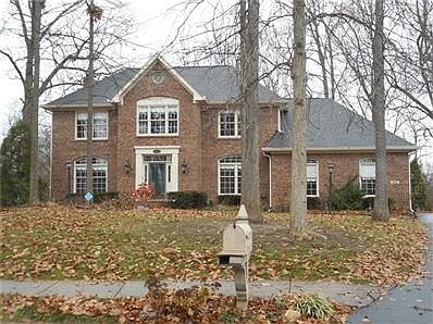 Custom Designed Home with Finished Basement on Wooded Lot!