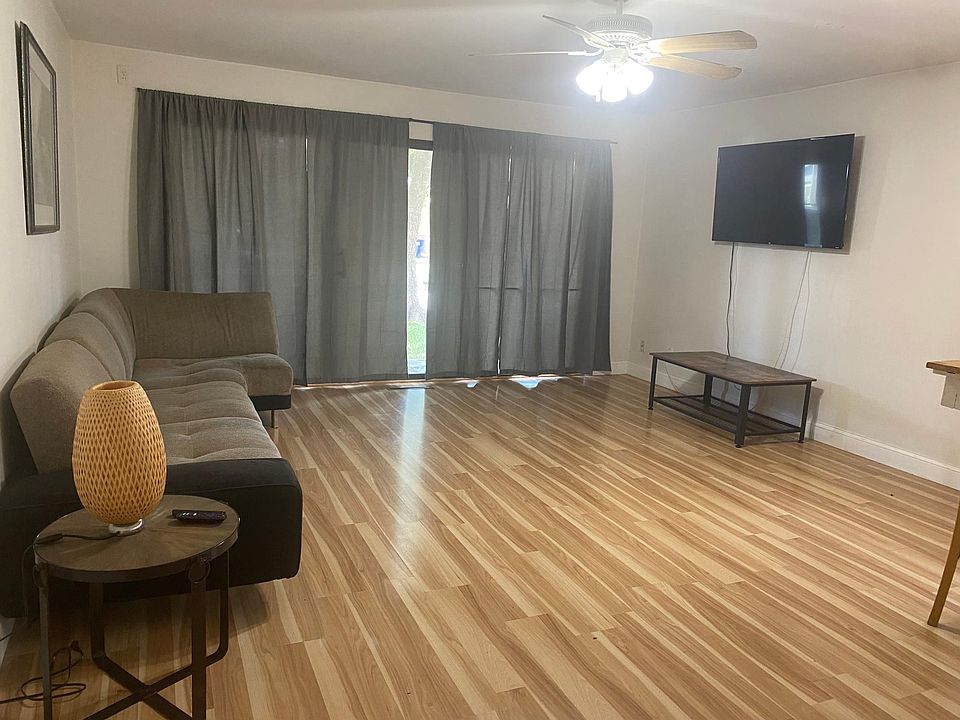 Large Living room looking out on to balcony.