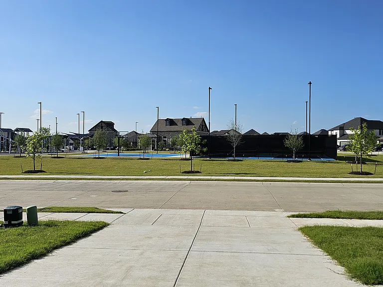 Prime location! Enjoy clear views of the community park and green space right from your front door