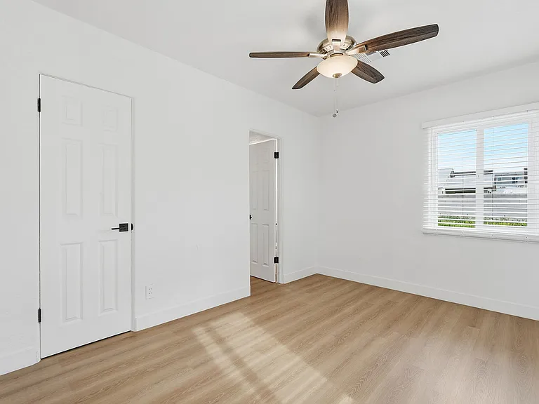 Bedroom 2 window to the East pulls in lots of light. Shared bathroom and closet to the left.