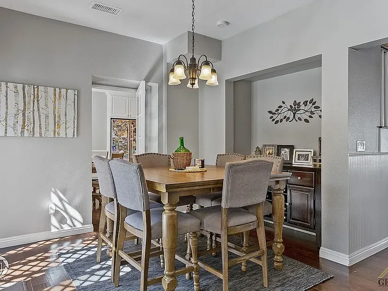 Back dining area with access to the kitchen.