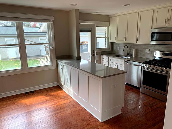 Kitchen and Dining Room (please note: photo taken at end of construction period - construction trailer no longer in backyard)
