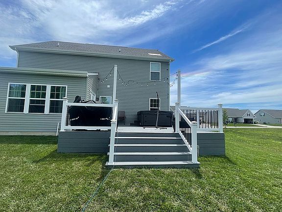 Back of home with 19x20 deck