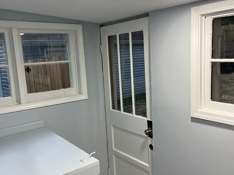 Laundry room back door into back yard and garage. Box is the entry into unfinished basement/ waterheater/ HVAC