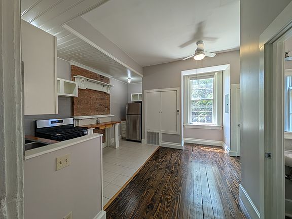 Sun-filled kitchen looks onto private back patio.