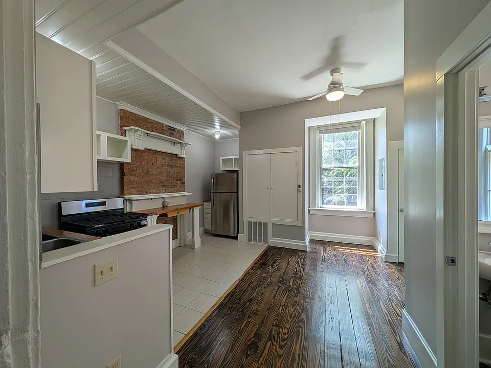 Sun-filled kitchen looks onto private back patio.