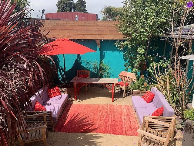 Our favorite place in the house--the backyard. We have an apricot tree, Moroccan mint and lemon verbana growing as well as lots of trees and flowers. The table is a COVID thing to have another workspace outside (there's power too AND a heating lamp!!)