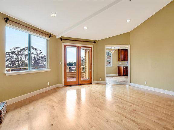 Living room to kitchen and balcony access