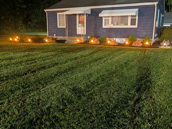 Nighttime photo of front yard.
