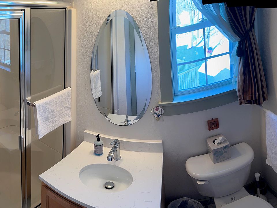 The full Bathroom has a shower, new vanity countertop, toilet and storage.