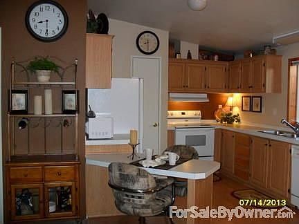 Kitchen and breakfast bar. : New paint adds a special touch to the kitchen and entire home.