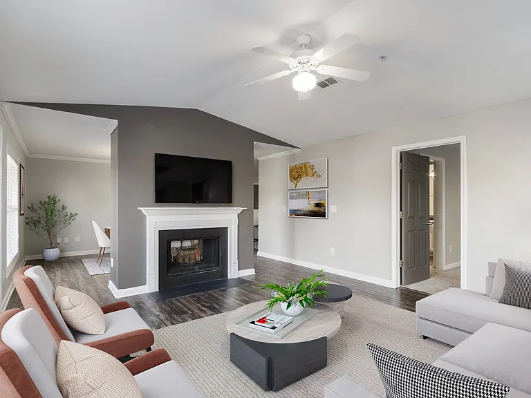 Renovated style home living room with a classic fireplace and mounted TV