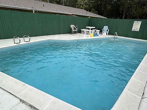 Pool with large fence