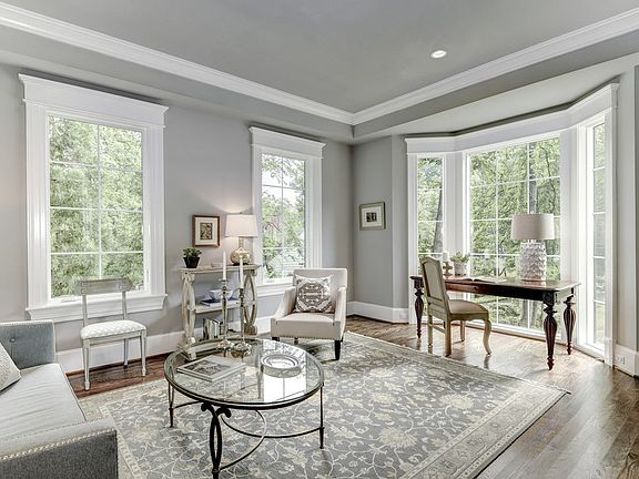 Library with tray ceiling + full height bay window