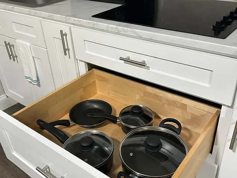 Cookware includes pots with lids and pans