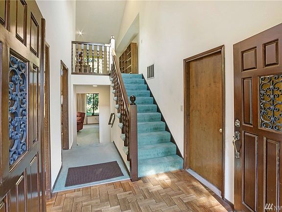 Additional view of the spacious entry.  The stairs lead to a roomy loft area that overlooks the formal living room.