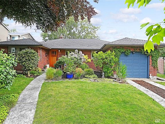 Mature landscaping at this classic Magnolia home includes a majestic Heritage Tree as well as two magnificent shade trees in the back yard.