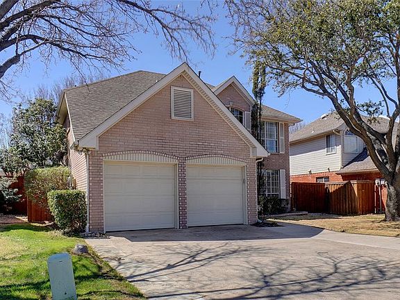 Spacious driveway with walking path