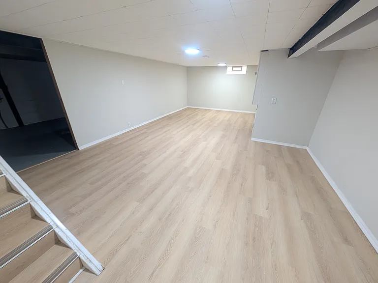 Half finished basement complete with new LED lights, LVP floors and an egress window.