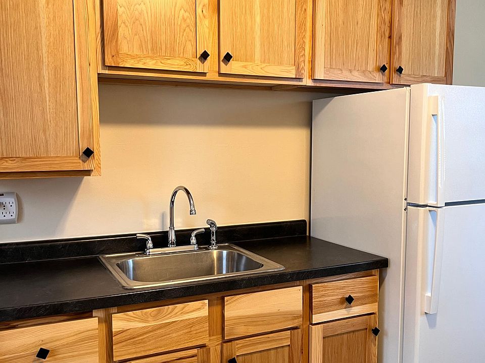 Newer kitchen cabinets, lots of storage, brand new fridge.