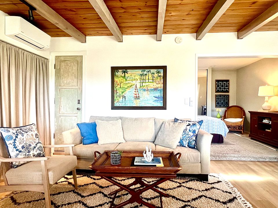 Living Area, shows new LVP floors, beam wood ceiling