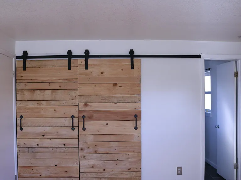 Primary bedroom bard door closet