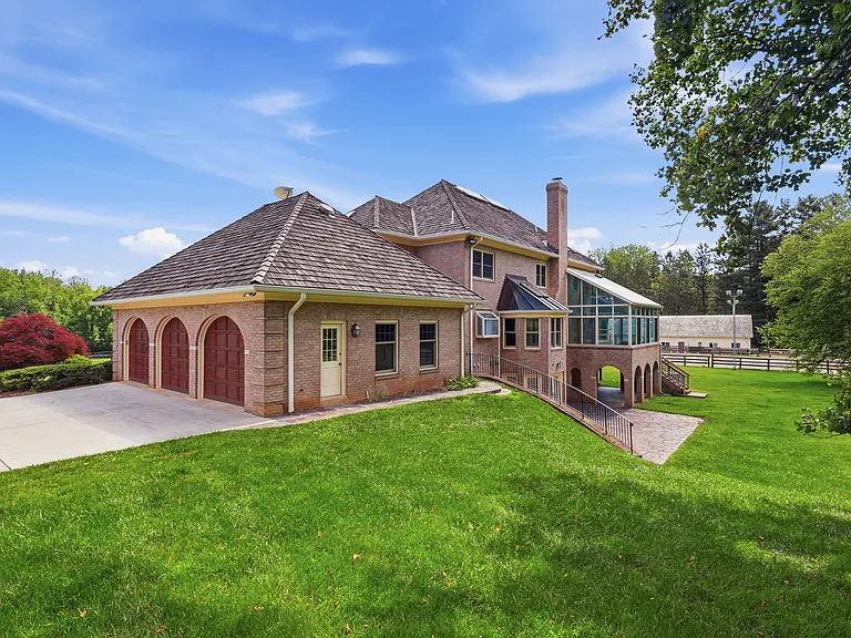 Spacious, private backyard with three-car garage.