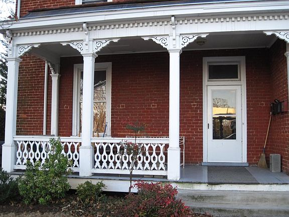 Front entry to foyer. The porch is available for tenant use. Front entry is shared with one other tenant who lives upstairs.