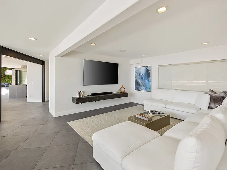 Natural light floods the room, illuminating the coastal-inspired decor.
