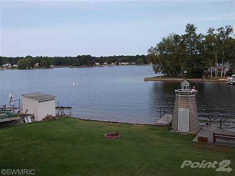 See no wake buoy, fire pit, dock, and lighthouse