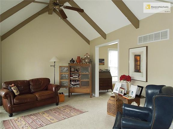 Living room with vaulted ceiling, lots of light.