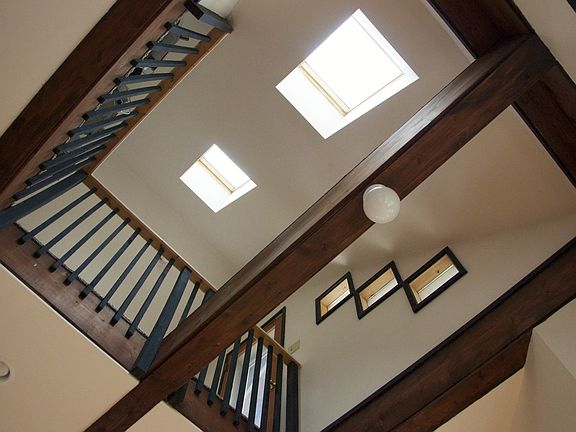 Large loft space, walkway to private creek view deck, and skylights.