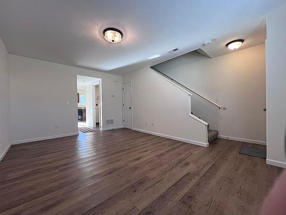 living room, storage space under stairs