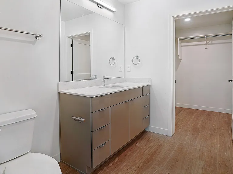 A private bathroom with integrated walk-in closet.