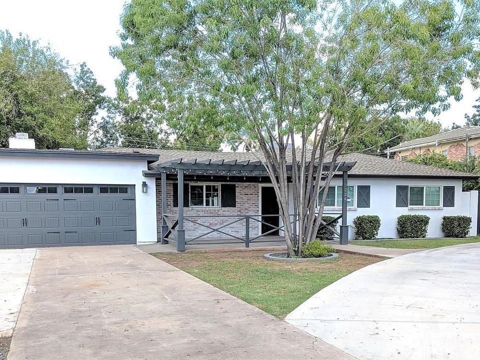 Front w.2 car garage & pergola