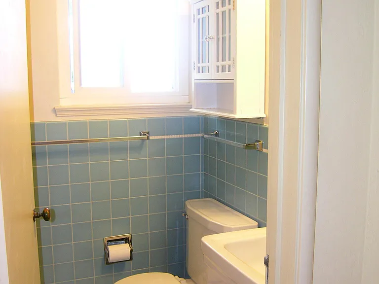 Bathroom with stall shower, no tub.