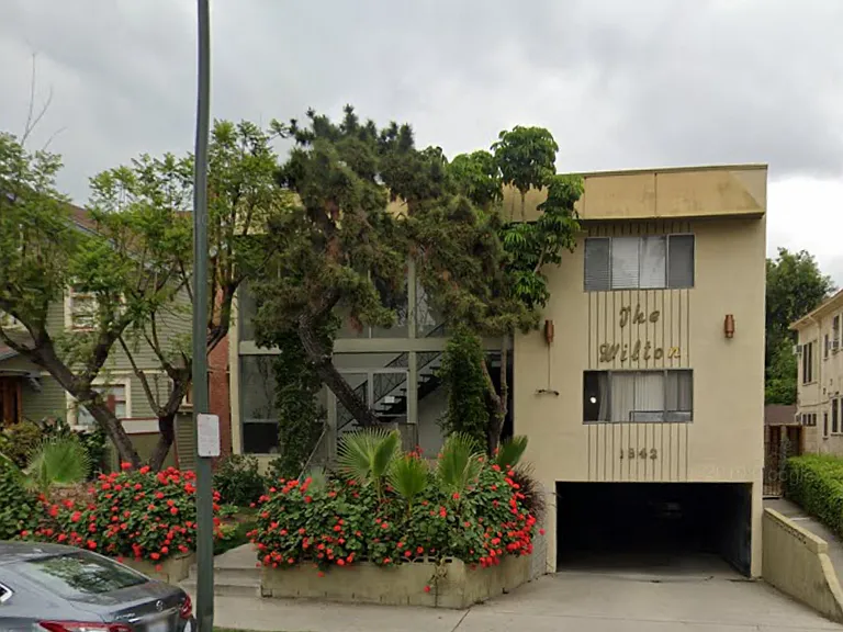 The unit includes one designated parking space. The garage is pictured.