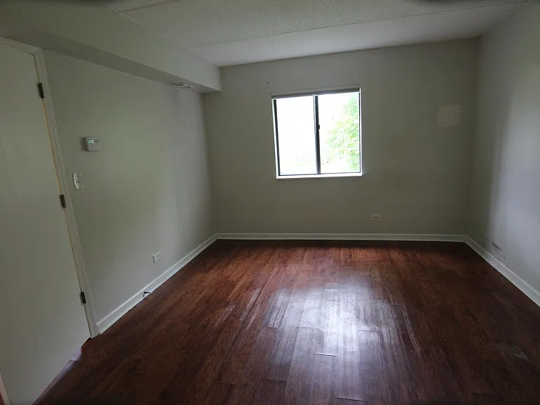 Bedroom. Vinyl wood-look flooring.