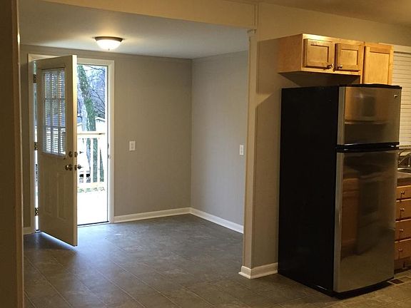 open floor plan, kitchen, breakfast, den, leading to back de