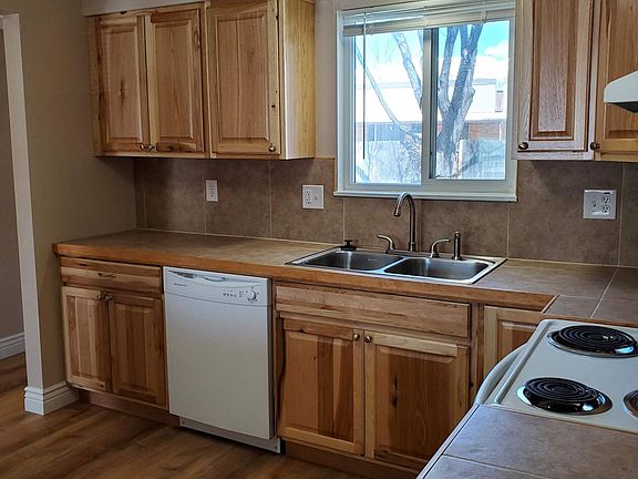 East kitchen wall - dishwasher and stove included