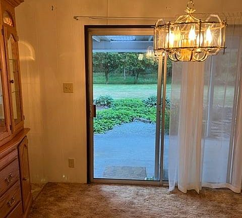 Dining room with hutch and slider to back porch