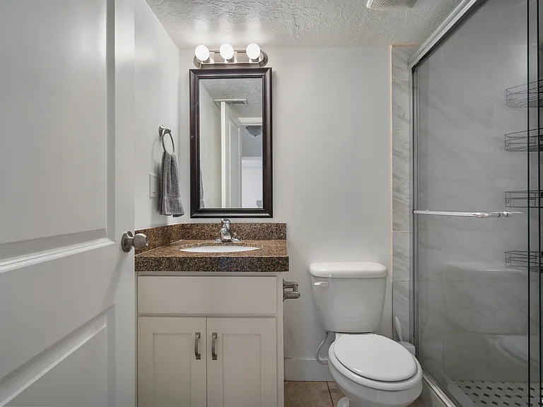 Downstairs bathroom with shower and sink.