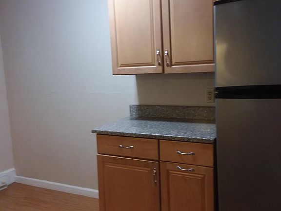 Maple cabinets, granite and stainless steel appliances.