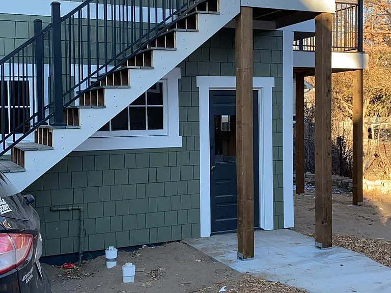Second-floor private staircase to keyless entry.