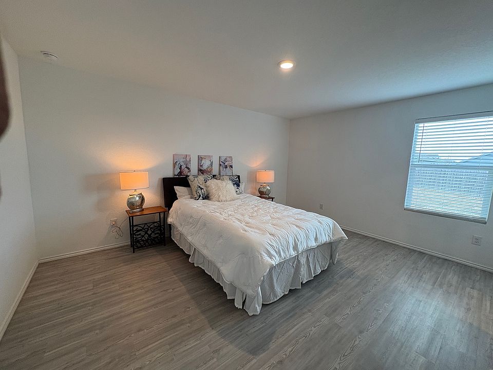Spacious primary bedroom with on-suite bathroom and walk-in closet.