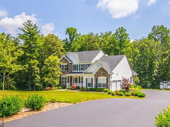 Long Asphalt Drive Leading to Side Load Garage