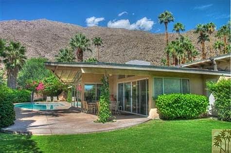 Back yard area showing pool and views.  Large overhang shades patio for lots of entertaining.