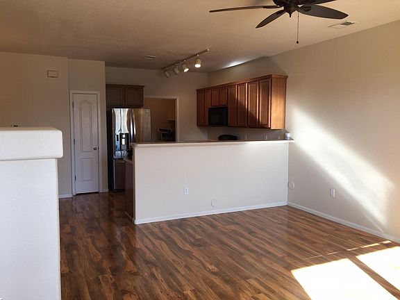 Front entrance - living room with ceiling fan