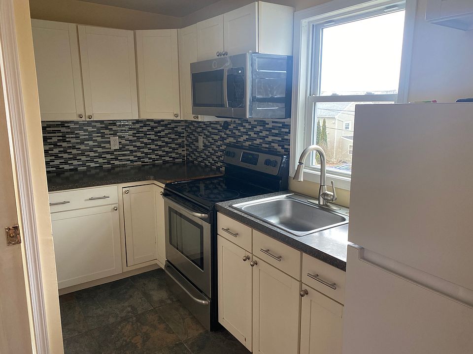 beautiful kitchen with microwave, stove/oven , refrigrator